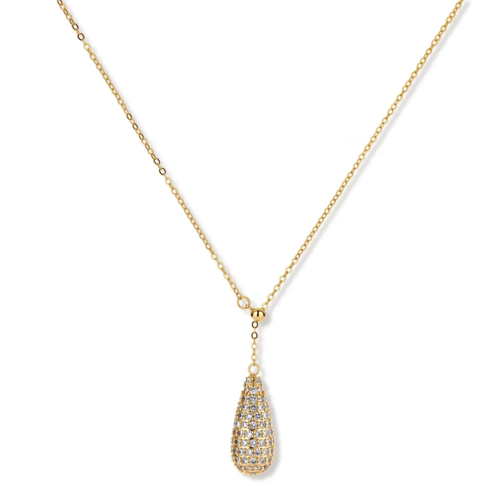 Gold-plated teardrop necklace and earrings covered in AAA cubic zirconia crystals on cream background.