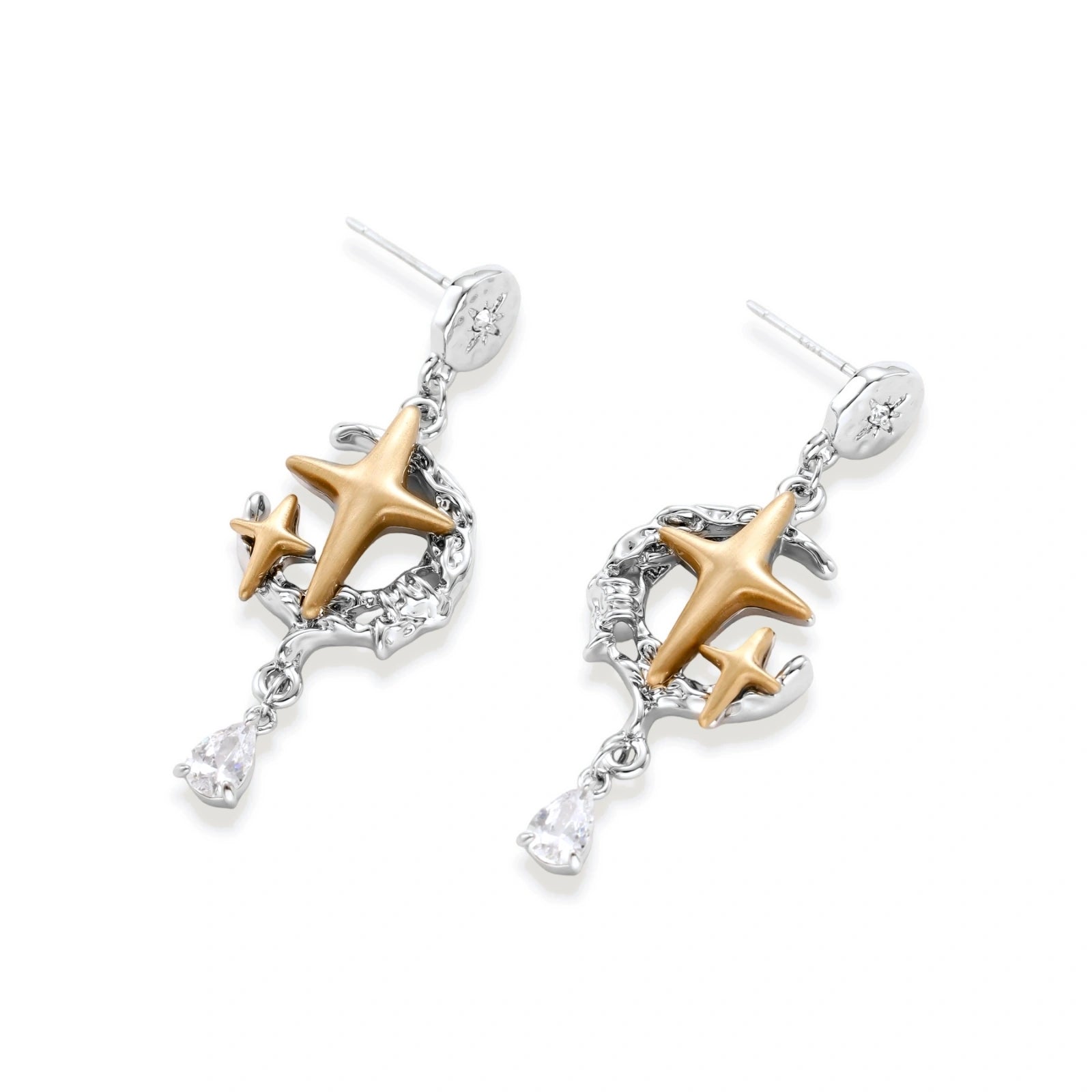 Delicate eco-brass jewelry set featuring gold star and silver moon crescents with clear zirconia crystal drops on cream background