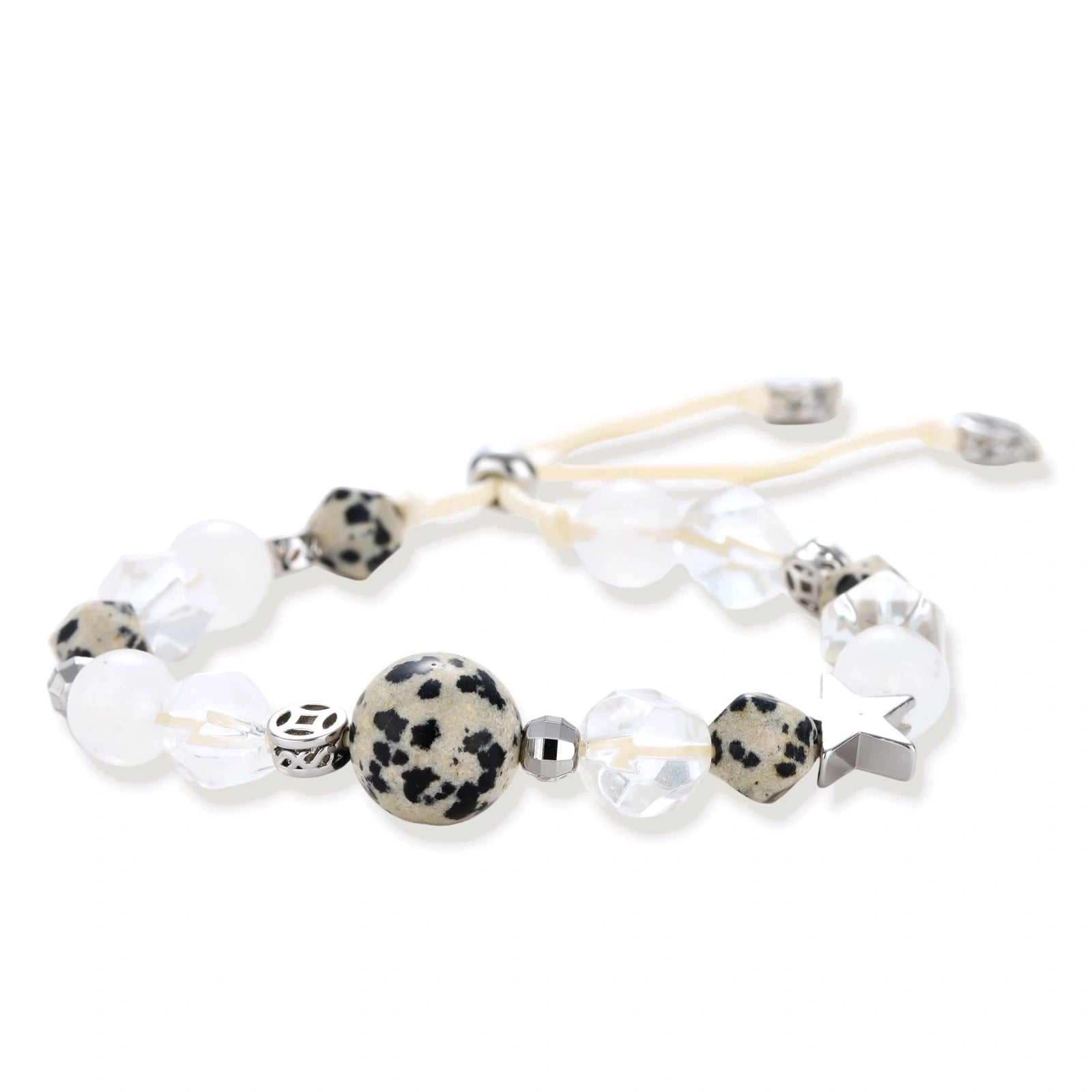 Adjustable beaded bracelet with spotted dalmatian stones, clear quartz crystals, and silver star charm on white background.