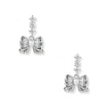 White gold plated drop earrings with three graduated zirconia crystals leading to a bow charm with pearl center