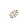 Two-tone ring with brushed silver center, gold beaded edges, and blue zirconia stones on white background.