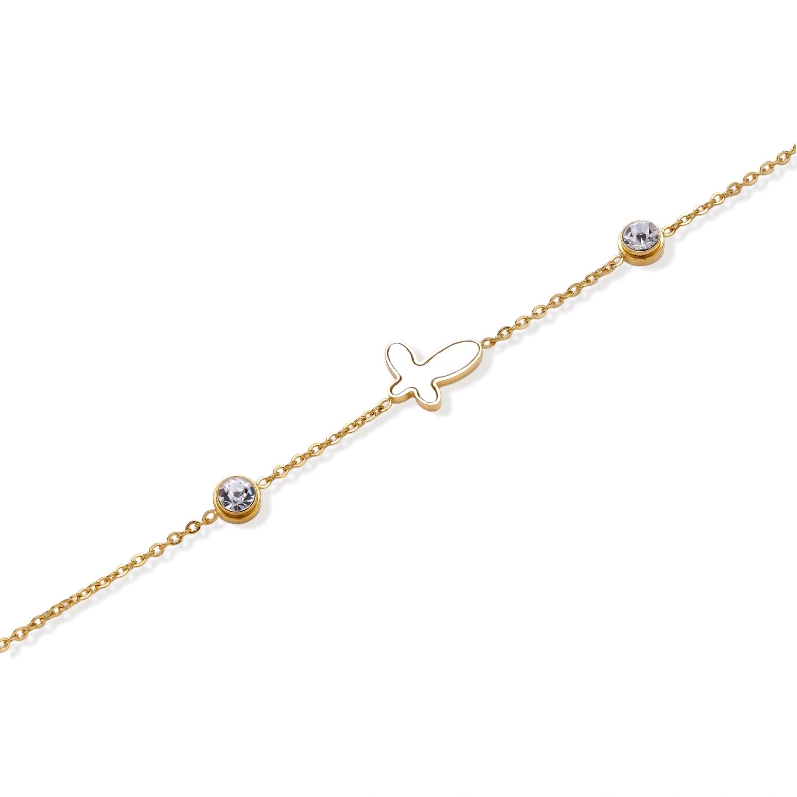 Gold chain bracelet with white mother of pearl butterfly pendant and two bezel-set crystals on cream background