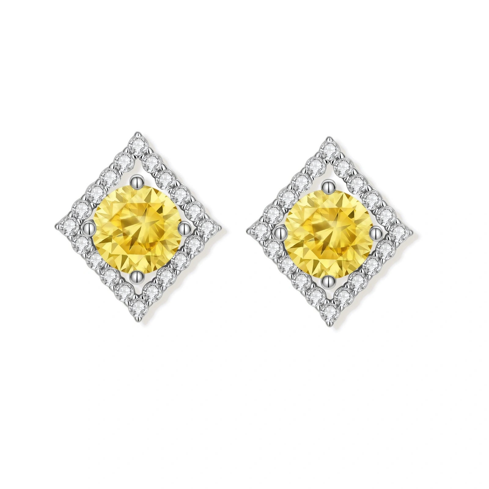 Close-up of diamond-shaped stud earrings with yellow moissanite centers and clear stone halos in sterling silver setting