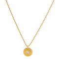 Gold-plated sterling silver necklace with sunburst pendant featuring radiating lines and cubic zirconia center stones