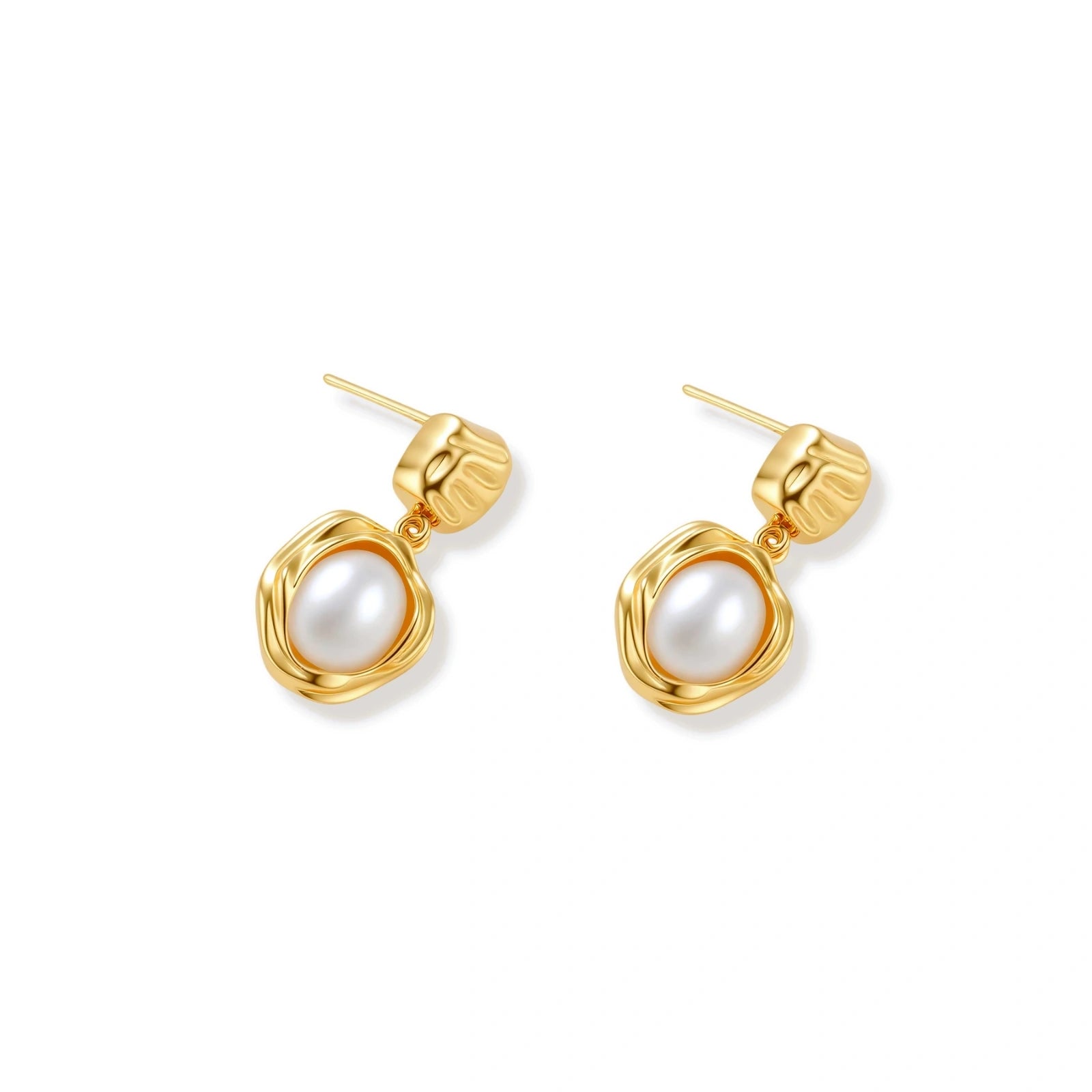 Gold-plated textured stud earrings with white freshwater pearl drops against cream background, showing organic rippled design