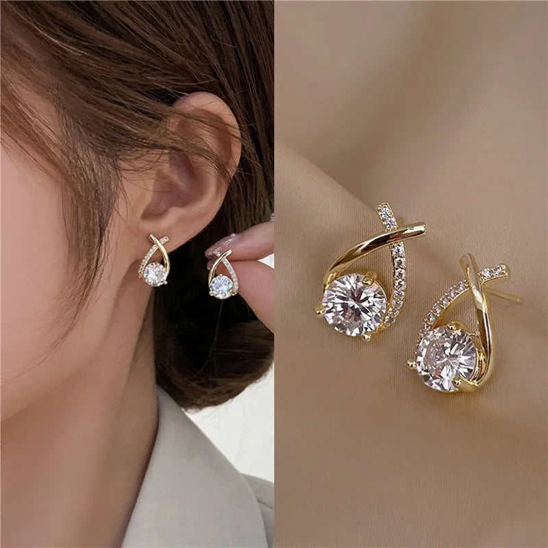 Petite silver-tone cross earrings with clear crystal details
