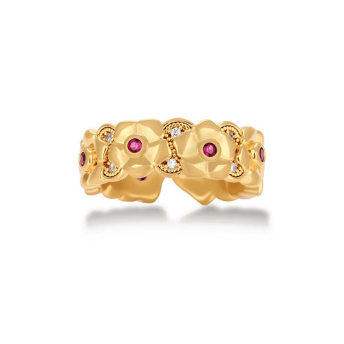 Adjustable gold-plated ring with burgundy zirconia centered flowers and crystal accents on cream background.