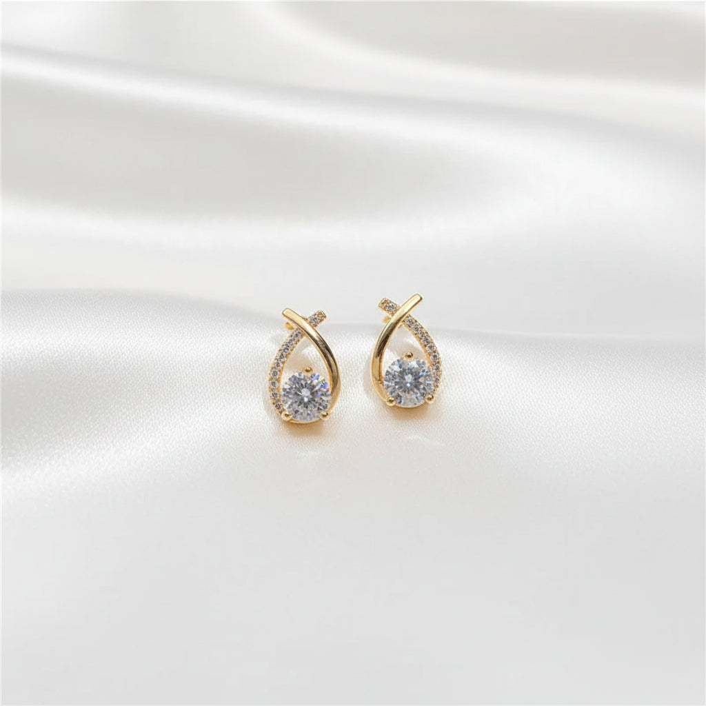Detailed view of Lumière crystal cross stud earrings
