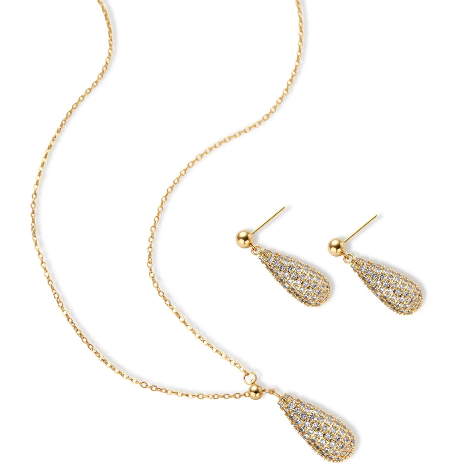 Gold-plated teardrop necklace and earrings covered in AAA cubic zirconia crystals on cream background.