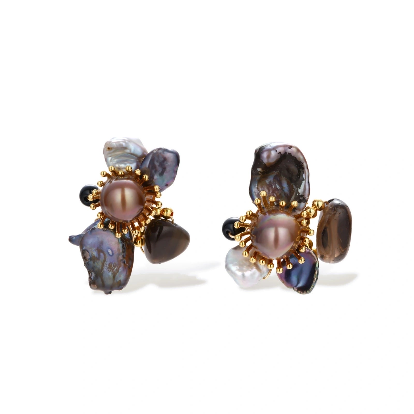 Dark baroque pearl cluster earrings with gold sunburst centers arranged in organic floral design on cream background.