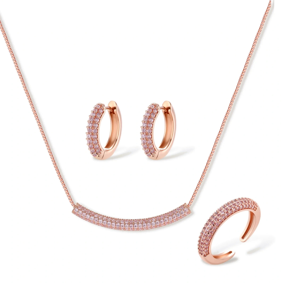 Rose gold pavé zirconia bar necklace, hoop earrings, and open ring set with pink stones on cream background.