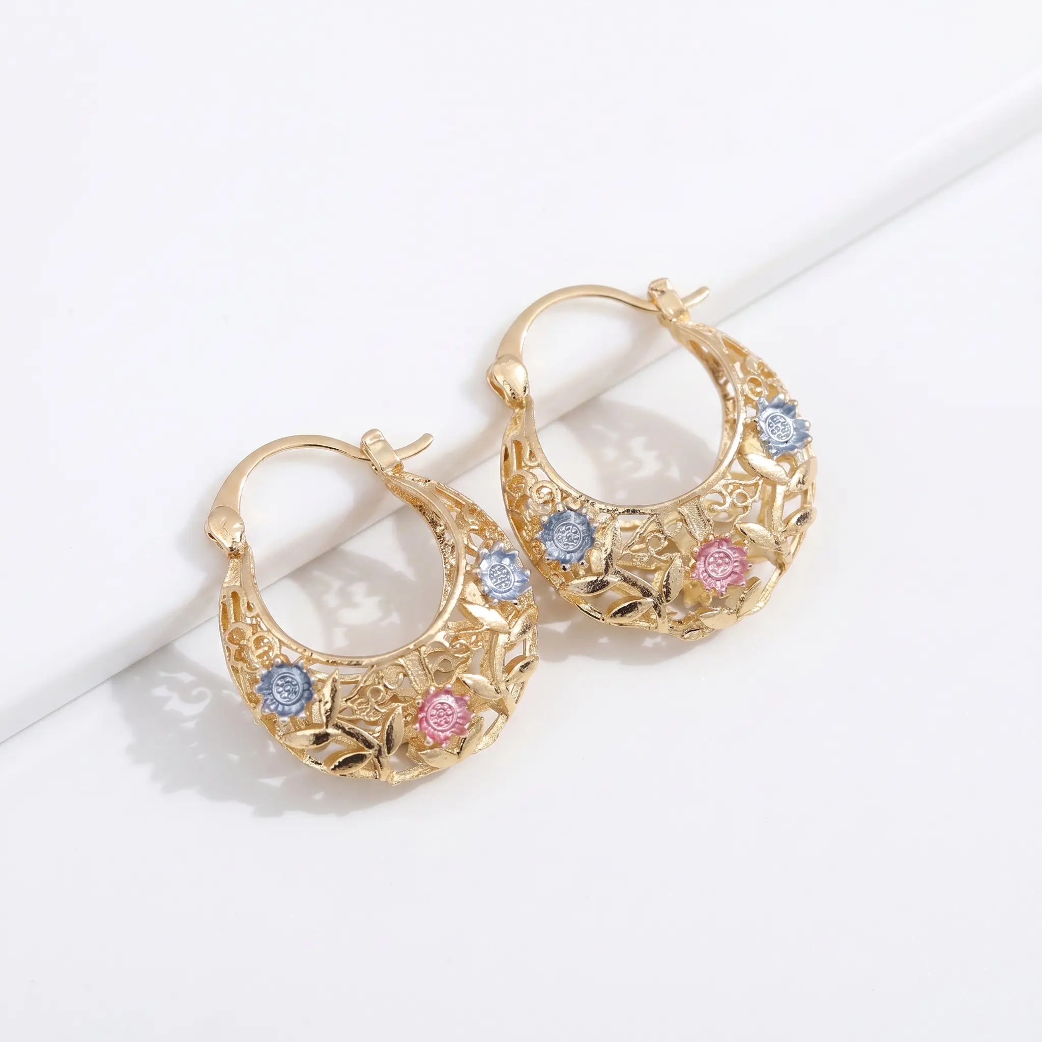 Carved Leaf Hoop Earrings — open hoop with engraved leaf and flower detail