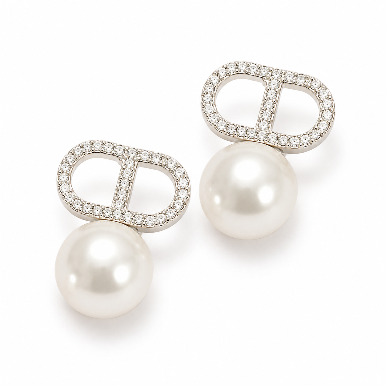 Éclat pearl pavé earrings on a clean product background