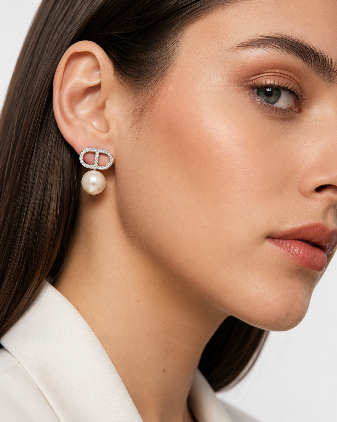 Model wearing Éclat pearl pavé stud earrings