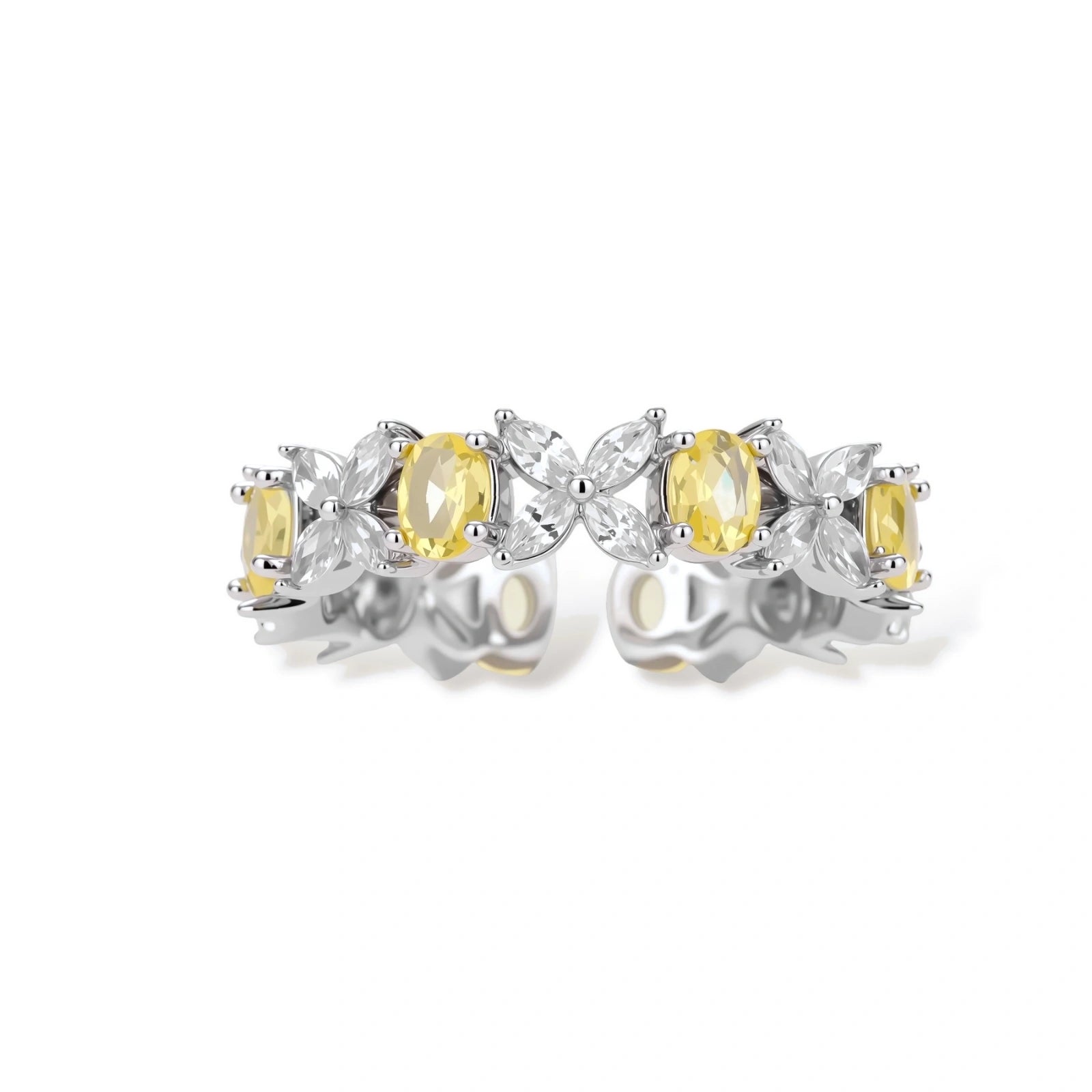 Close-up of platinum-plated copper eternity ring featuring alternating yellow and clear marquise-cut stones in elegant band setting.