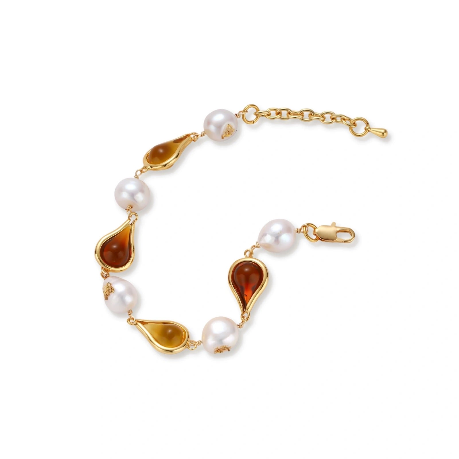 Elegant bracelet with alternating baroque pearls and amber teardrop gemstones set in 18k gold-plated copper on cream background.