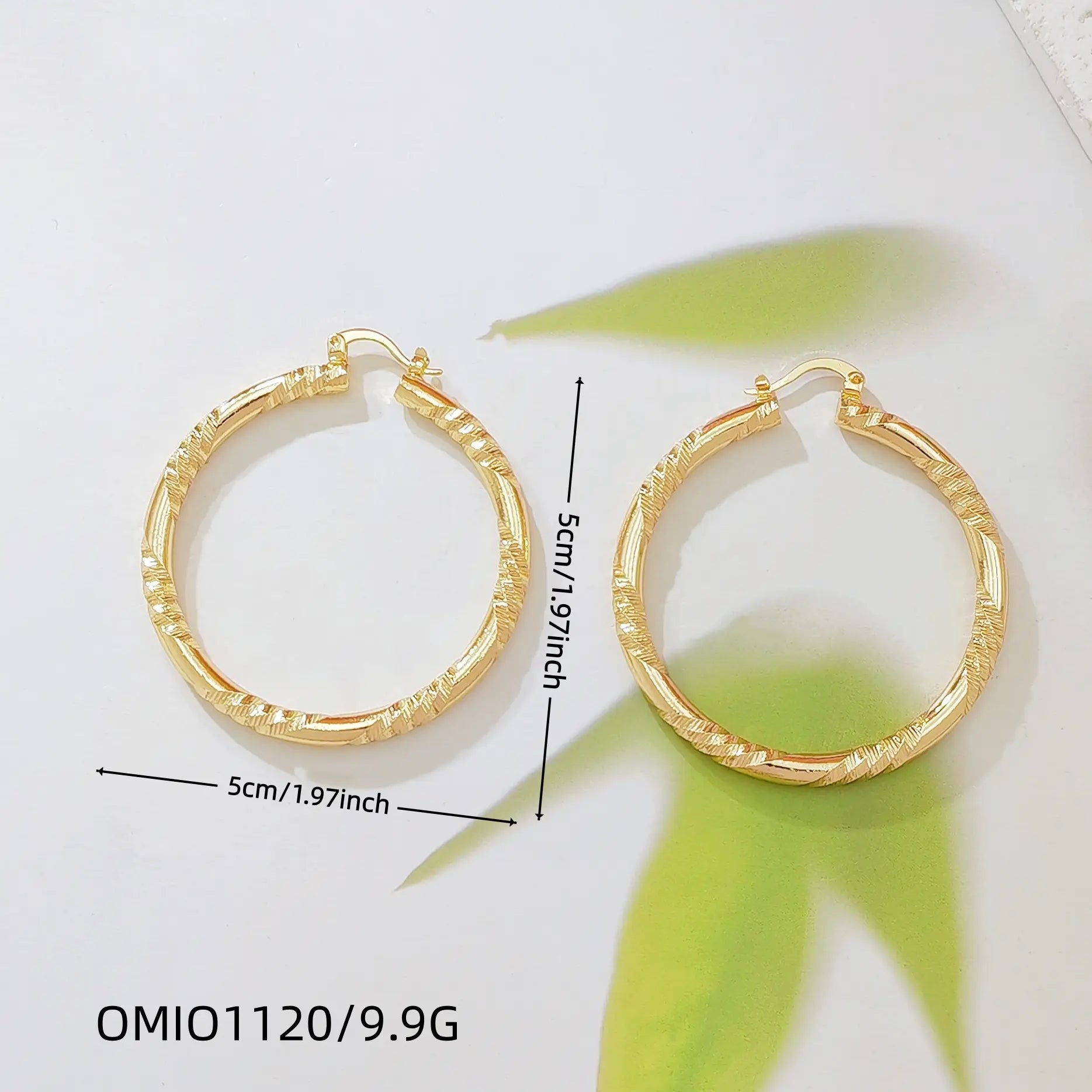 Twisted Gold Huggie Hoops — faceted diamond-cut huggie hoop earrings