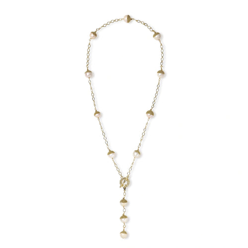 Gold-plated lariat necklace with baroque pearls and textured caps on cream background, showing adjustable Y-shaped design.