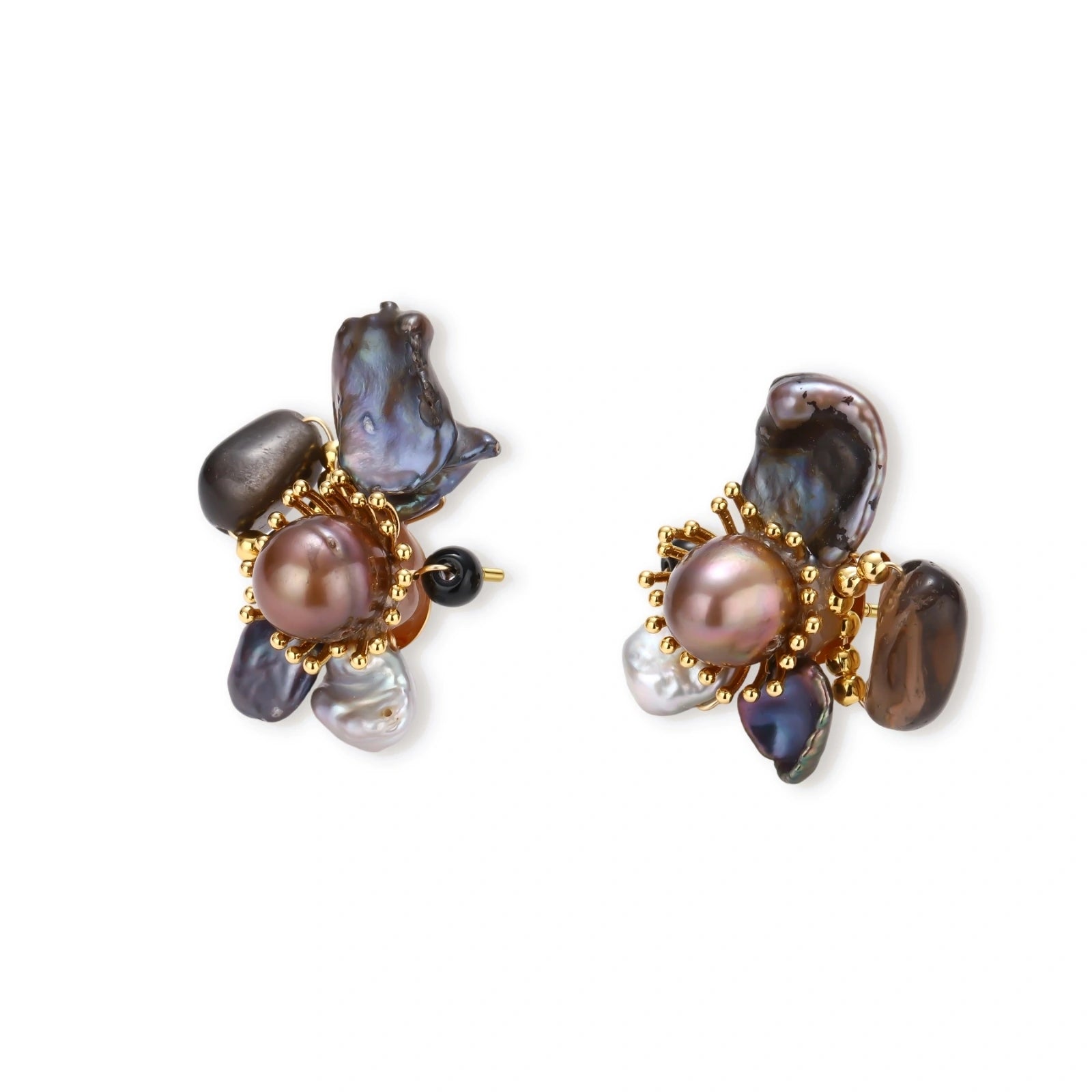 Dark baroque pearl cluster earrings with gold sunburst centers arranged in organic floral design on cream background.