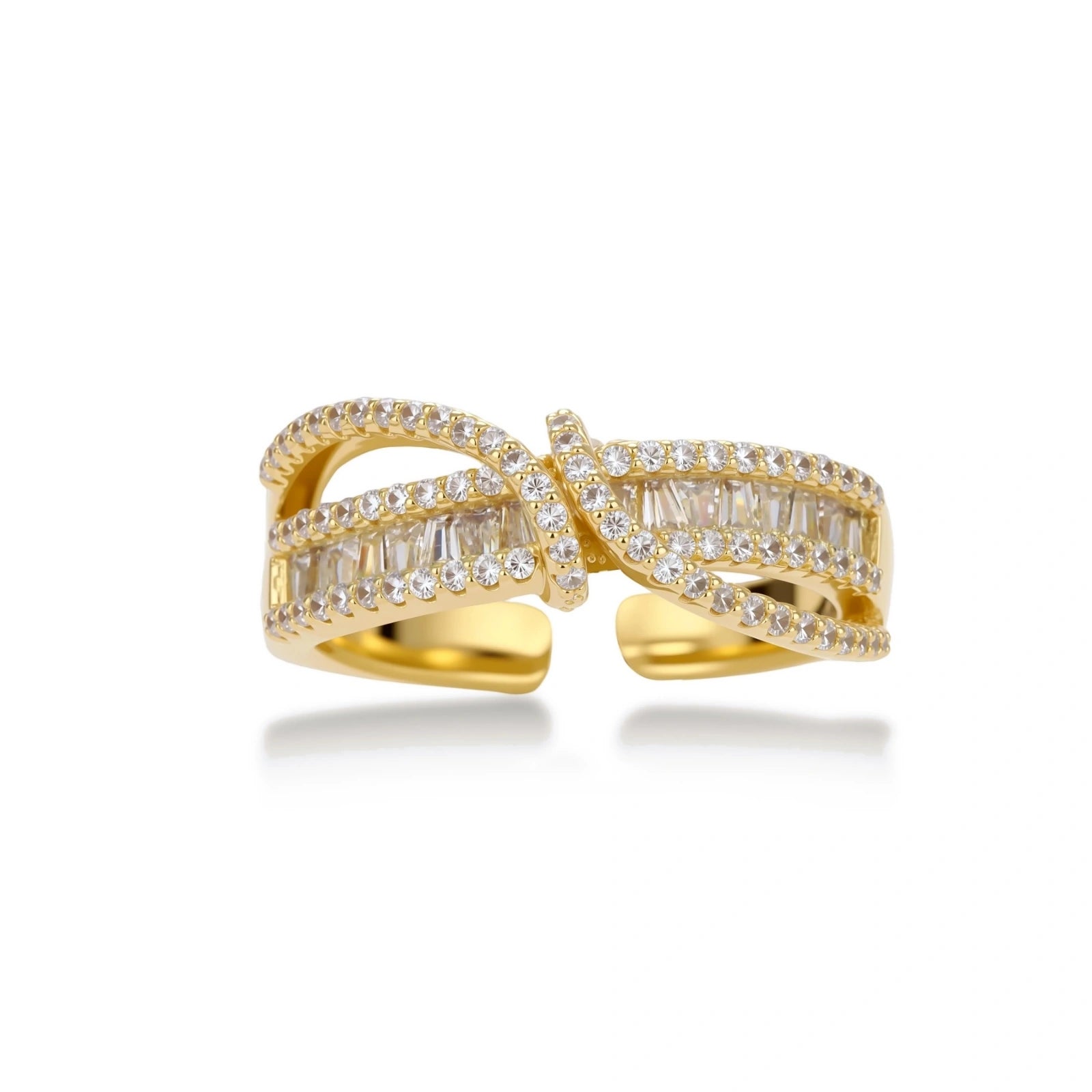 Close-up of gold-plated adjustable ring with crossing bands and sparkling zirconia stones on white background.